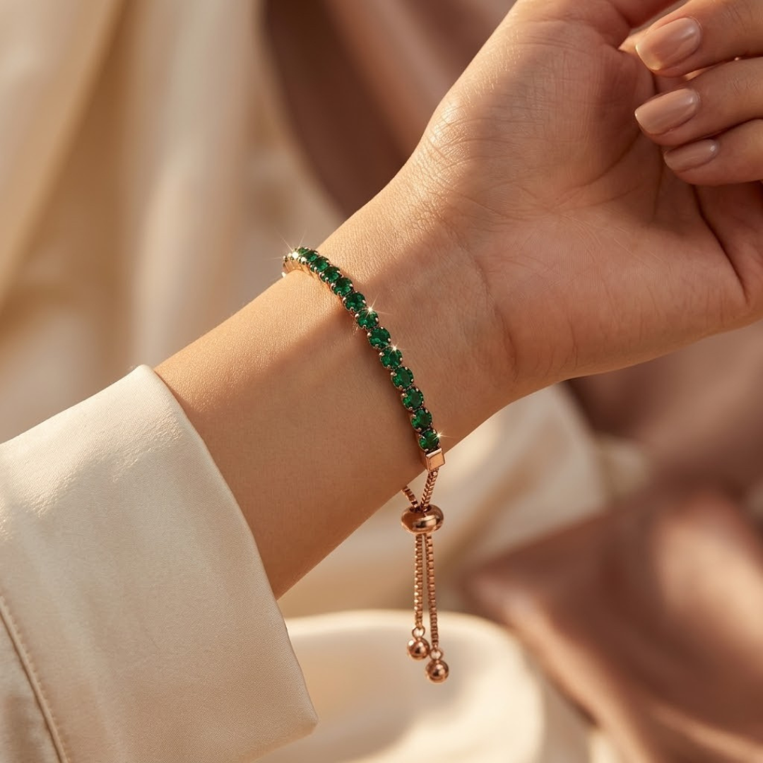 Verstelbare tennisarmband met smaragd in goud