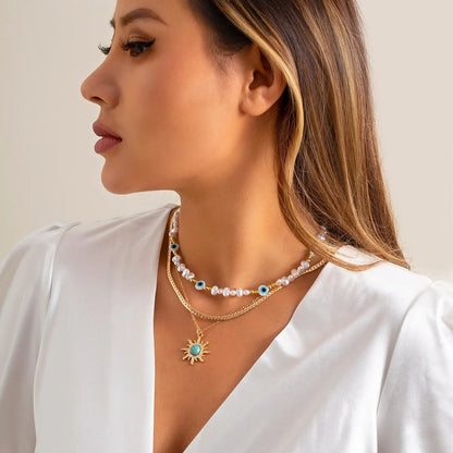 Set van Gelaagde Kettingen Parels & Boze Oog – Boho Zonnehanger