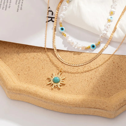 Set van Gelaagde Kettingen Parels & Boze Oog – Boho Zonnehanger